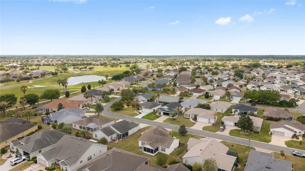 an aerial view of residential building and parking space