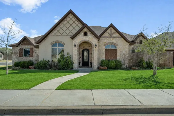 front view of a house with a yard