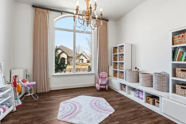 a room with furniture a rug and a window