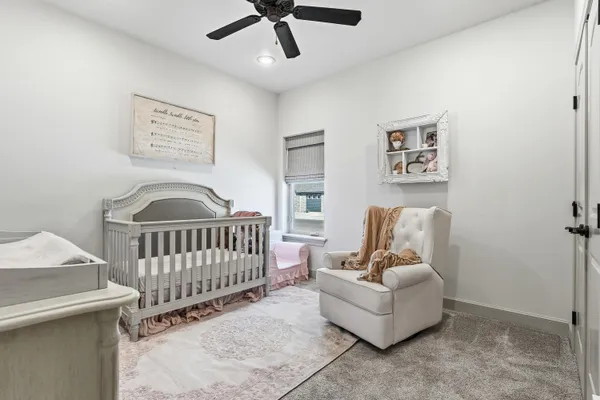 a bedroom with furniture and a window