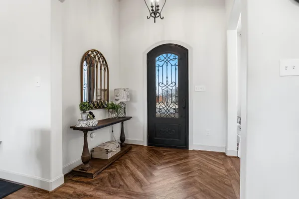 a view of hall way with furniture