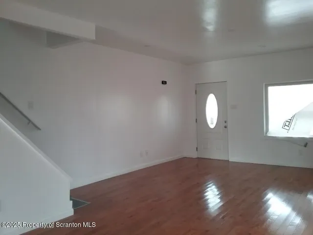 a view of a livingroom with wooden floor