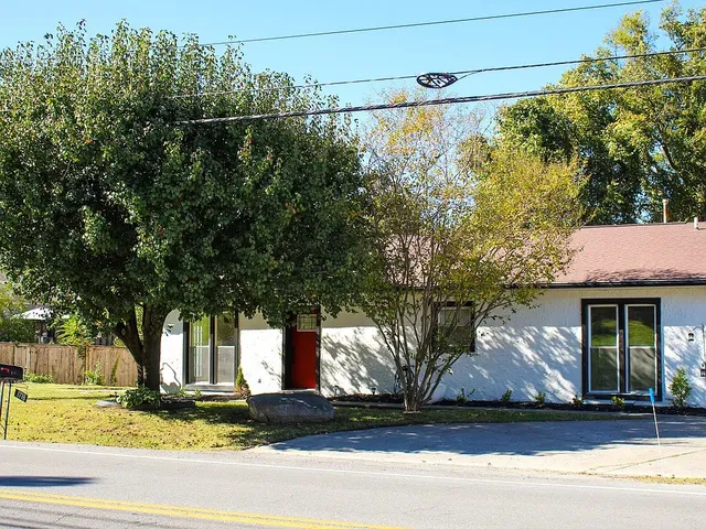 a front view of a house with garden