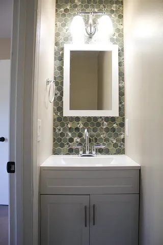 a bathroom with a sink and a mirror