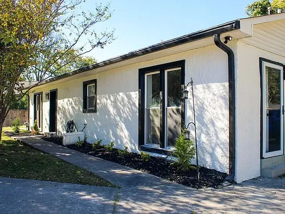 a front view of a house with garden