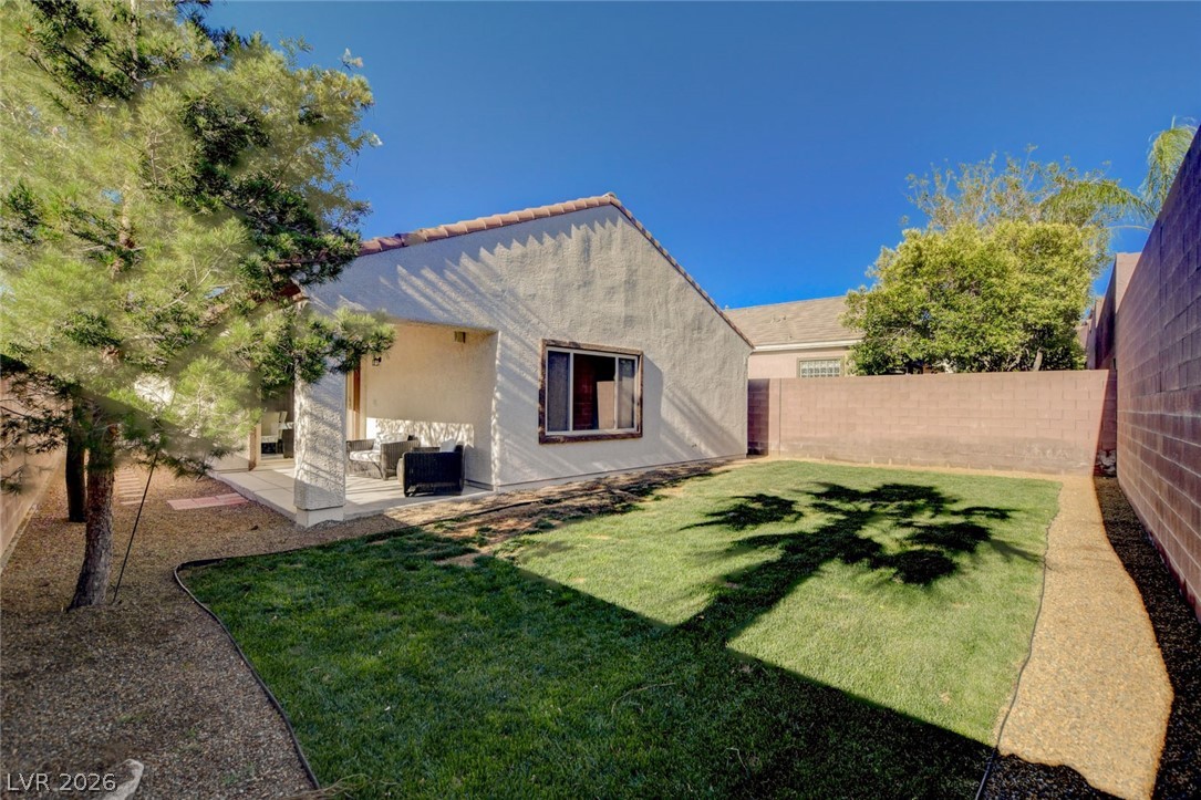 2649 Rue Marquette Avenue Henderson, NV 89044 - Photo 52 of 55 This private rear yard offers a covered patio and a neat lawn for outdoor enjoyment.