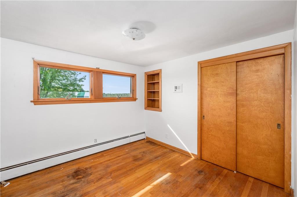 738 Fredonia Road Stoneboro, PA 16153 - Photo 36 of 38 a view of an empty room with wooden floor and a window