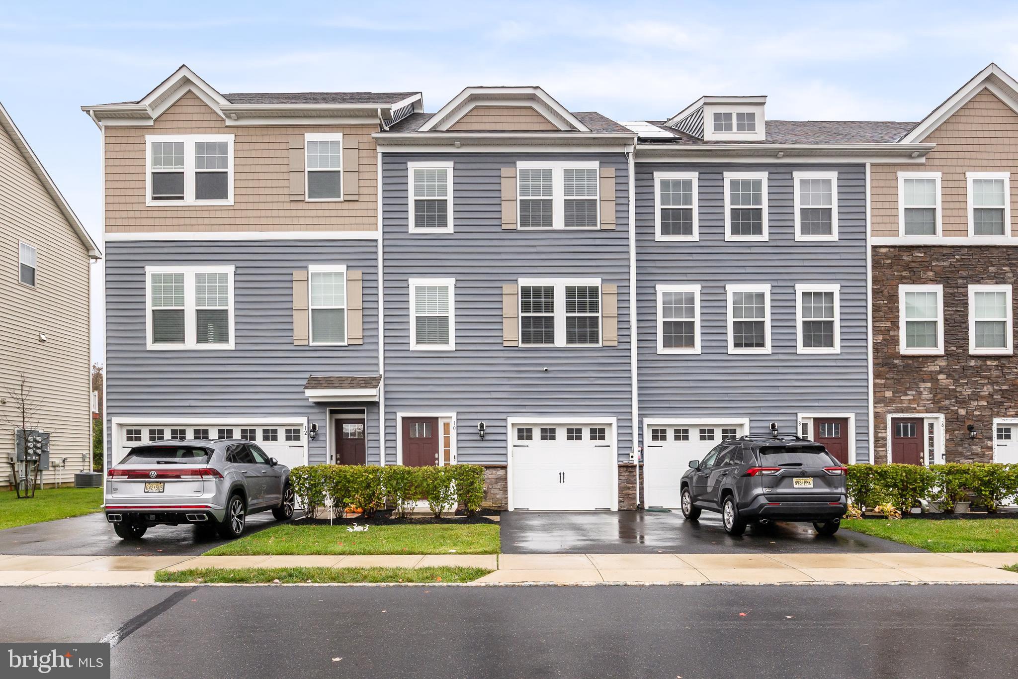 a car parked in front of a brick house