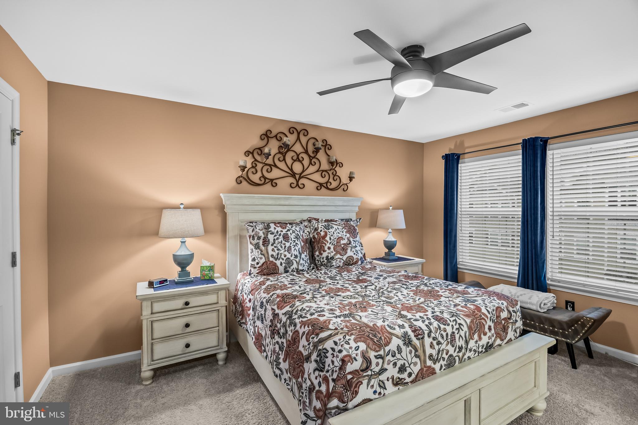 10 Naples Lane Mount Laurel, NJ 08054 - Photo 17 of 27 a bed sitting in a bedroom next to a window and a chandelier