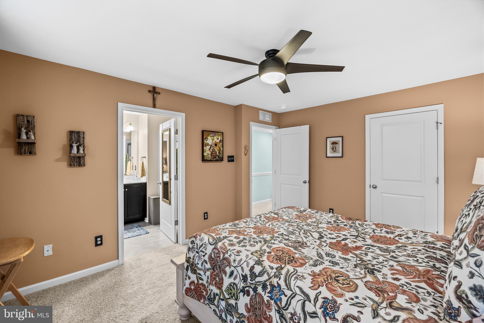 10 Naples Lane Mount Laurel, NJ 08054 - Photo 18 of 27 a bedroom with a large bed and a chandelier