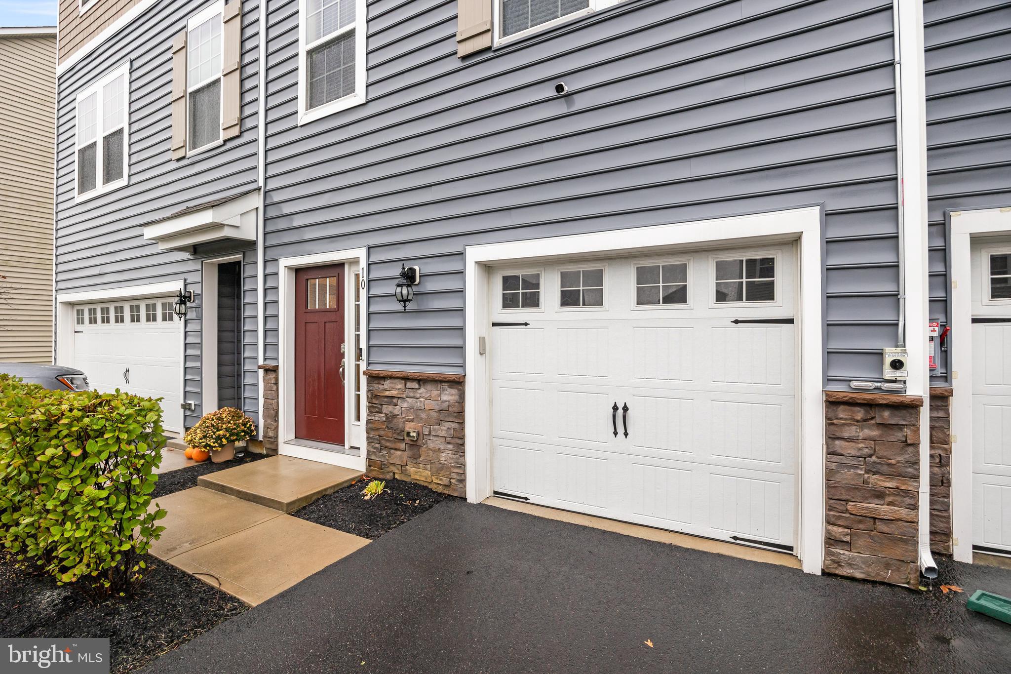 10 Naples Lane Mount Laurel, NJ 08054 - Photo 2 of 27 a front view of a house with a garage