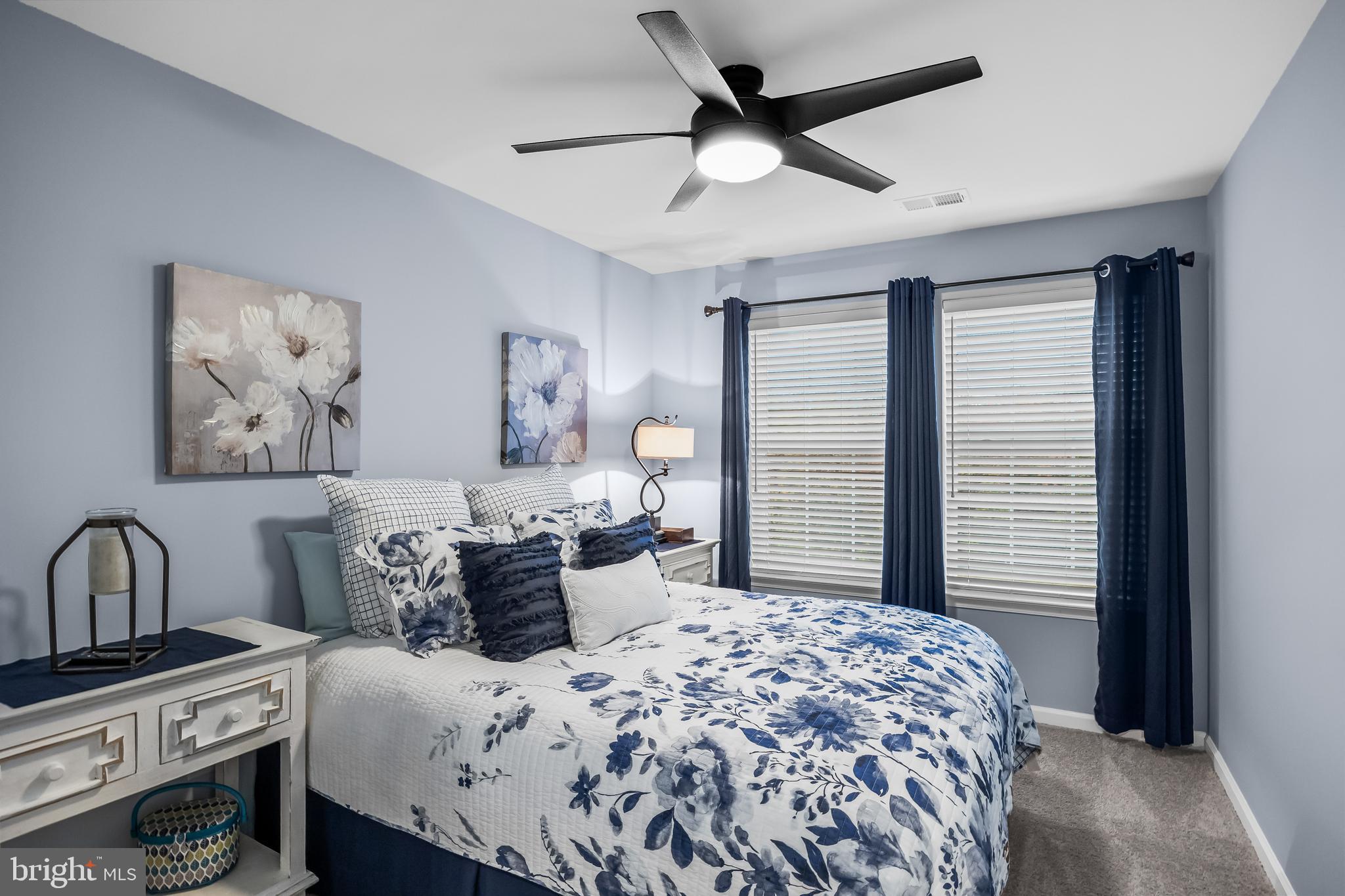 10 Naples Lane Mount Laurel, NJ 08054 - Photo 21 of 27 a bedroom with a bed and a chandelier