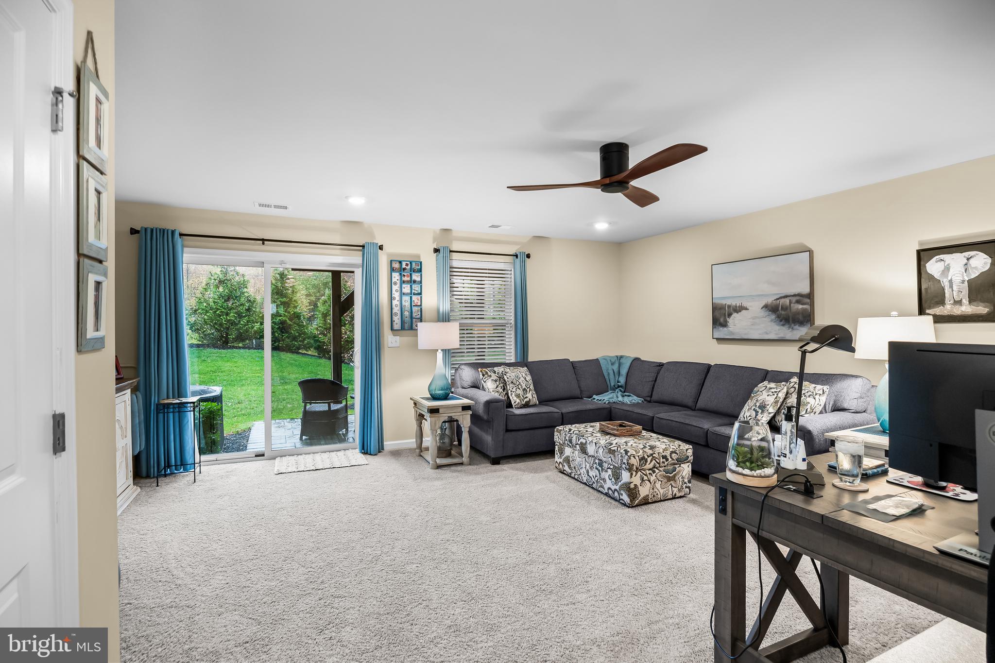10 Naples Lane Mount Laurel, NJ 08054 - Photo 6 of 27 a living room with furniture a ceiling fan and a floor to ceiling window