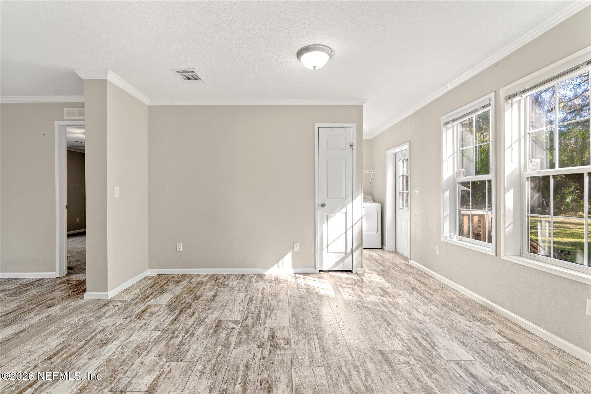 130 Sisco Road Pomona Park, FL 32181 - Photo 13 of 43 a view of a livingroom with wooden floor and a window