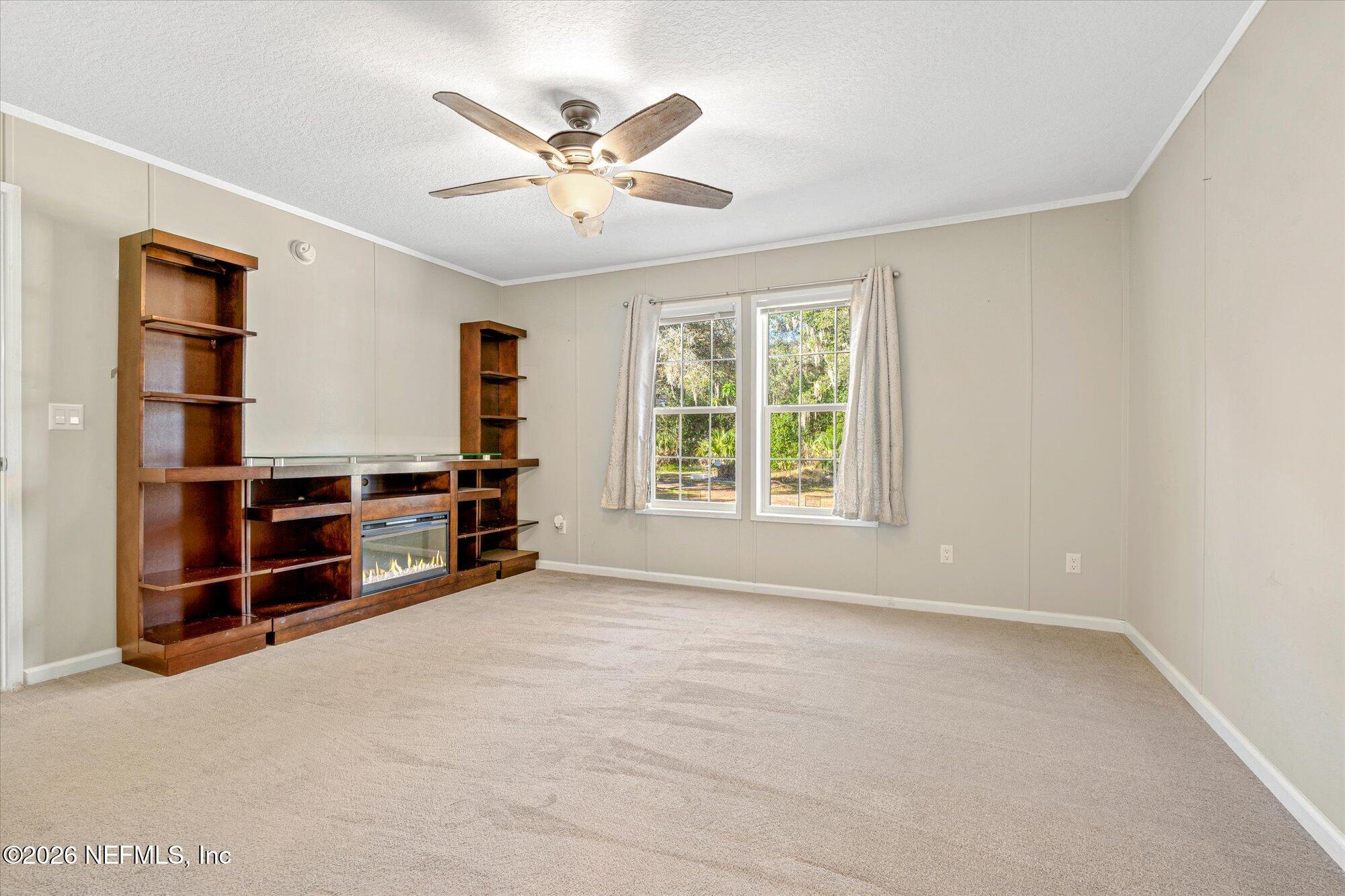 130 Sisco Road Pomona Park, FL 32181 - Photo 15 of 43 a view of an empty room with a window