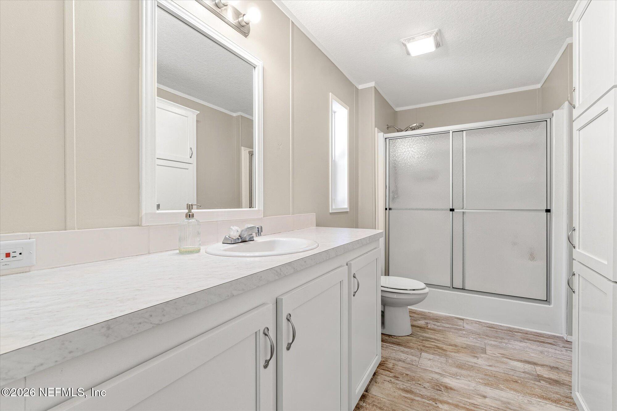 130 Sisco Road Pomona Park, FL 32181 - Photo 17 of 43 a bathroom with a sink a toilet and shower