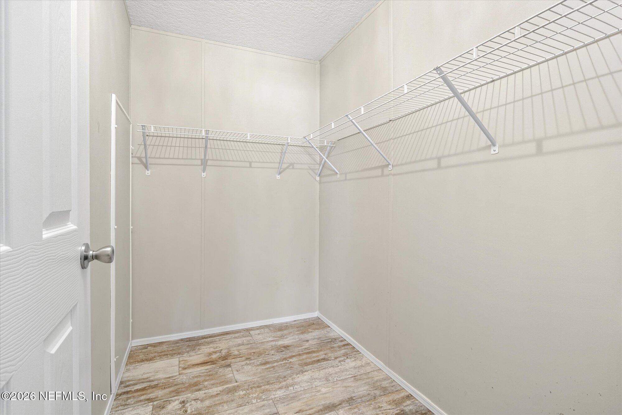 130 Sisco Road Pomona Park, FL 32181 - Photo 20 of 43 a view of a room with racks on the wall