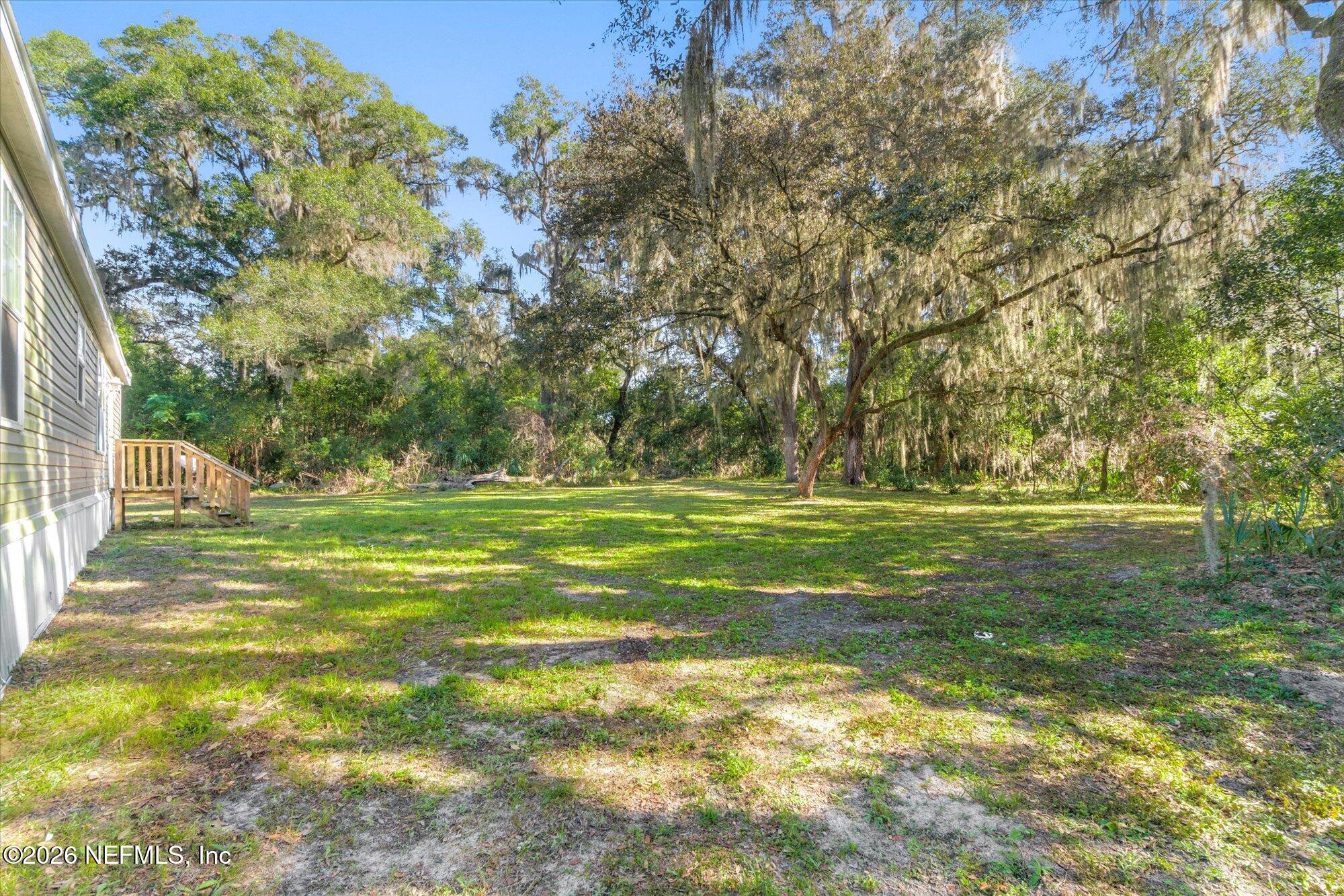 130 Sisco Road Pomona Park, FL 32181 - Photo 31 of 43 a view of a golf course with a trees