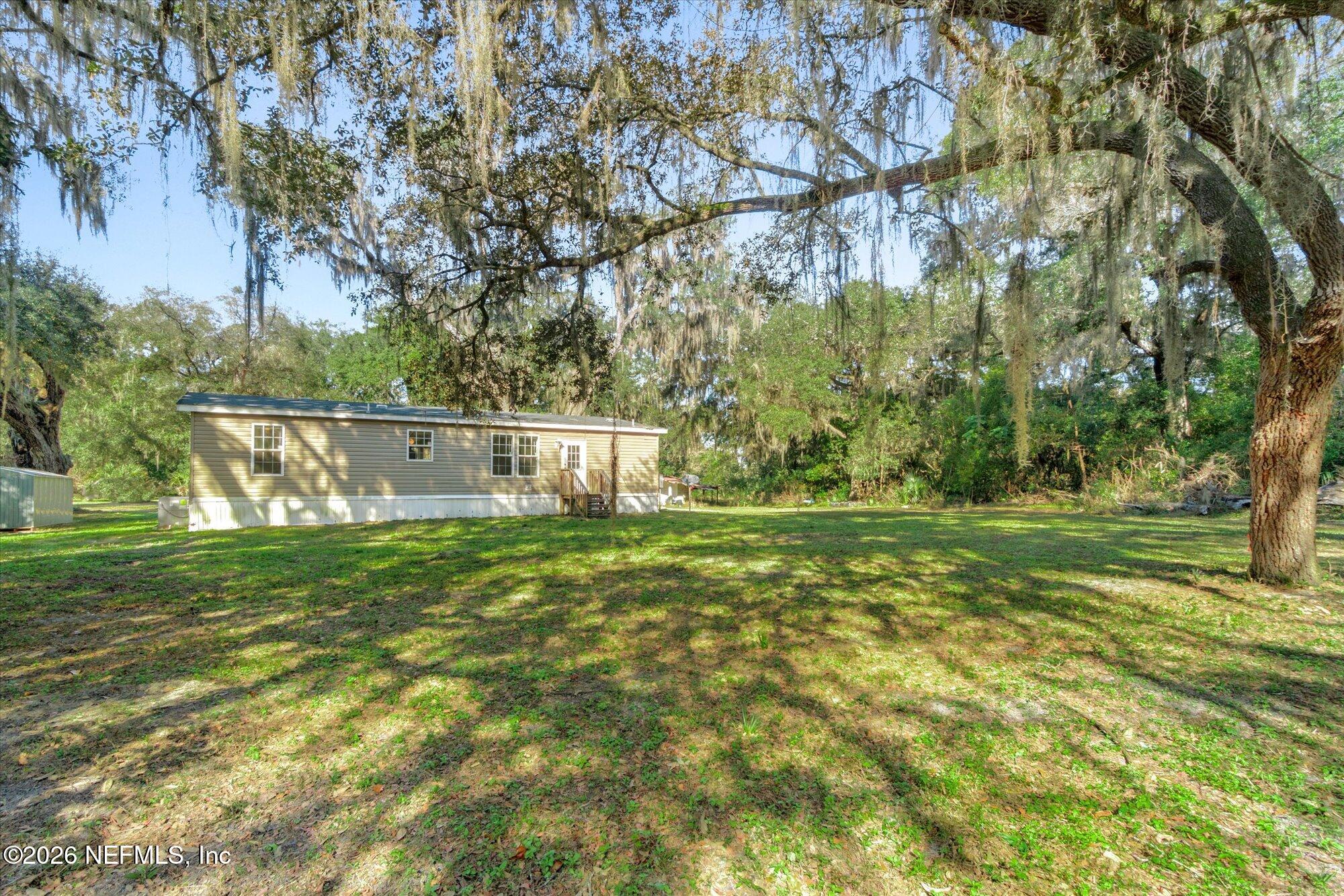 130 Sisco Road Pomona Park, FL 32181 - Photo 32 of 43 a view of a park with large trees