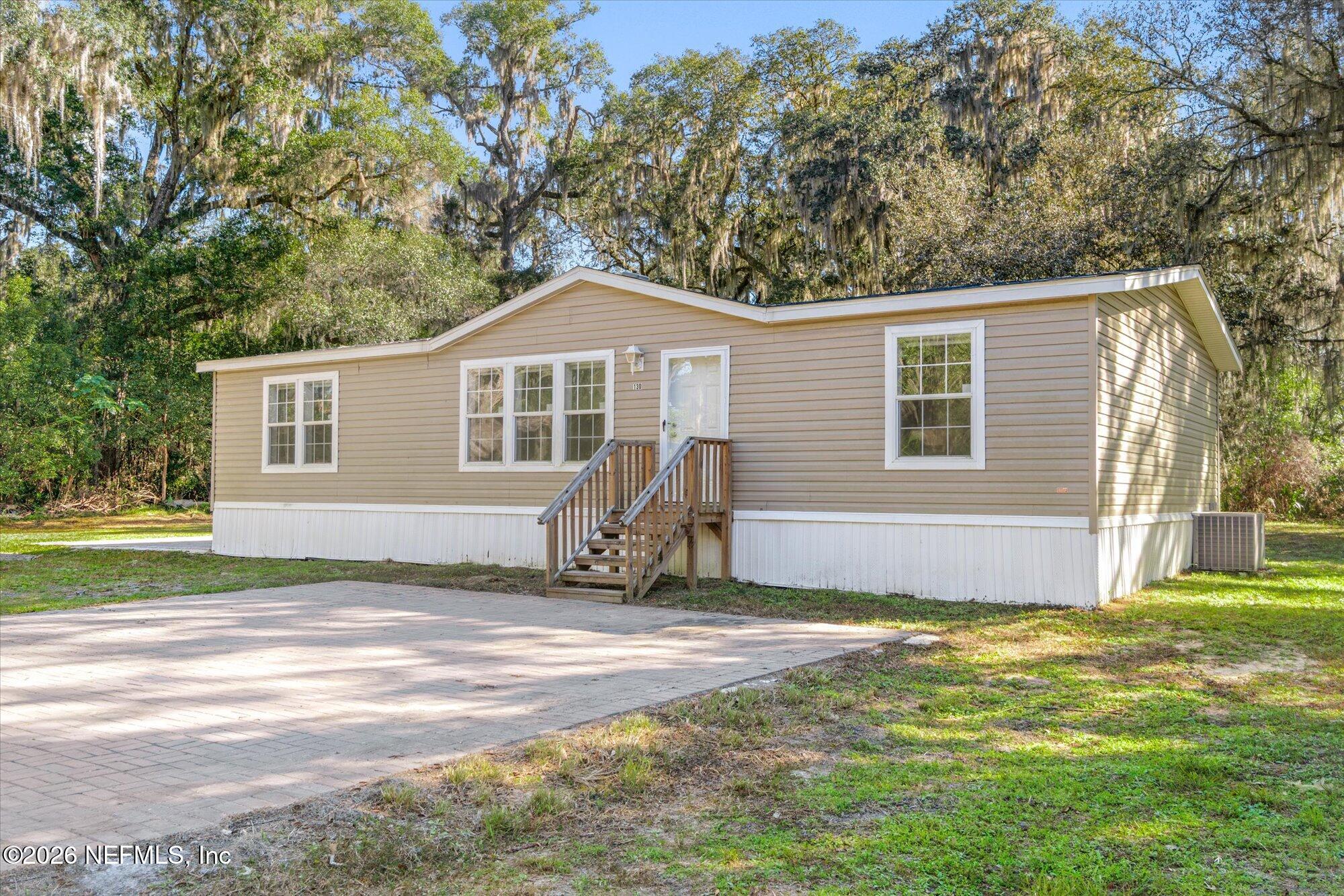 130 Sisco Road Pomona Park, FL 32181 - Photo 5 of 43 a house view with a garden space