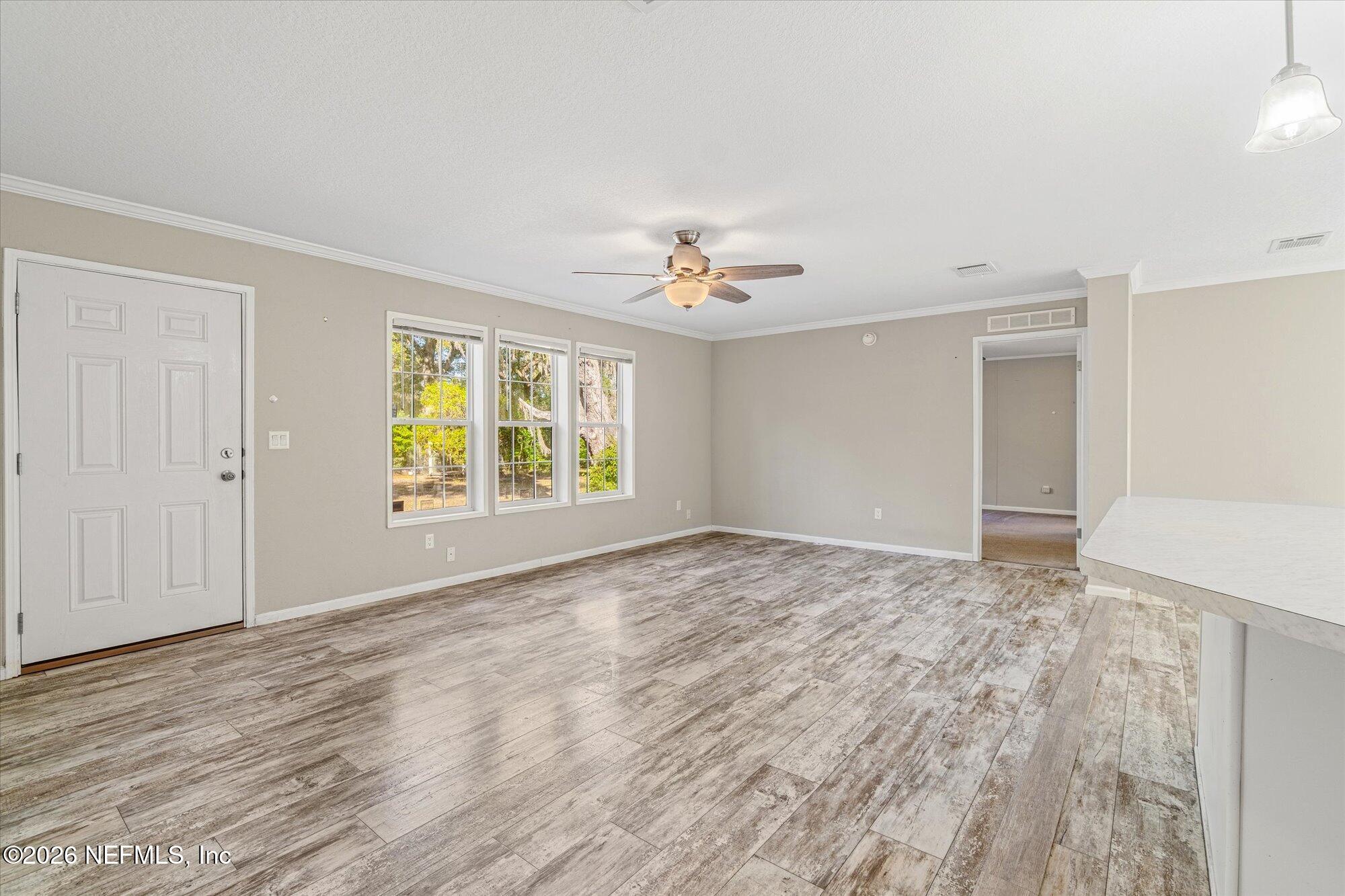 130 Sisco Road Pomona Park, FL 32181 - Photo 7 of 43 a view of an empty room with a window