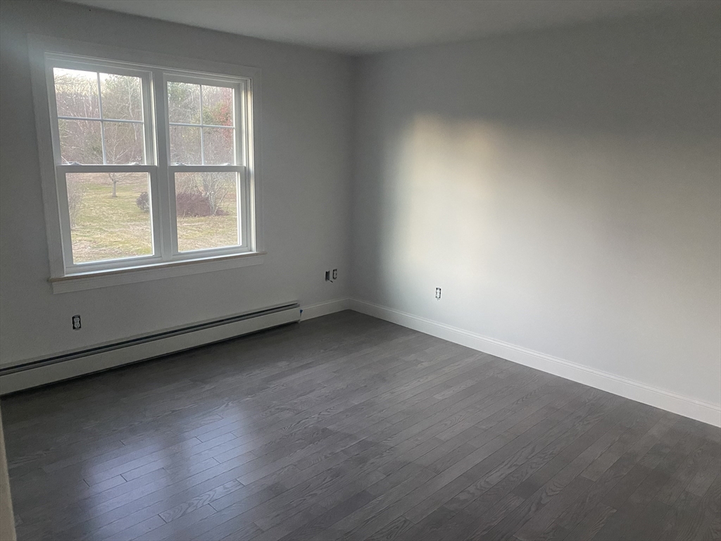 572 Wheelwright Road Barre, MA 01005 - Photo 7 of 8 an empty room with a window
