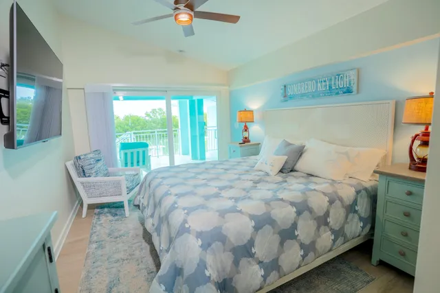 a bathroom with a sink mirror and toilet