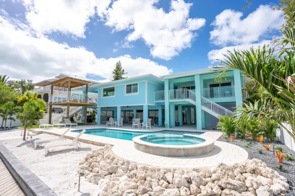 an aerial view of a house with a ocean view