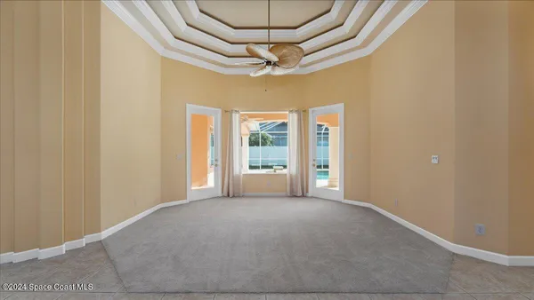 en empty room with windows and outdoor view