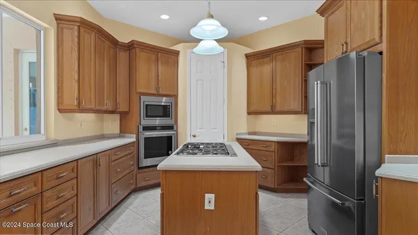 a kitchen with a stove and a cabinet