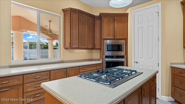 a kitchen with a sink and a window