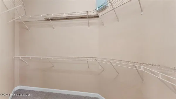 a bathroom with a granite countertop tub sink and mirror