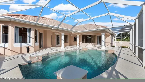 a view of a swimming pool with a patio