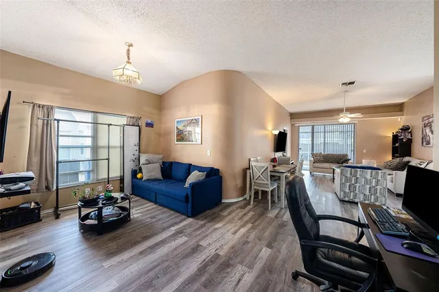 a living room with furniture or couch and a flat screen tv