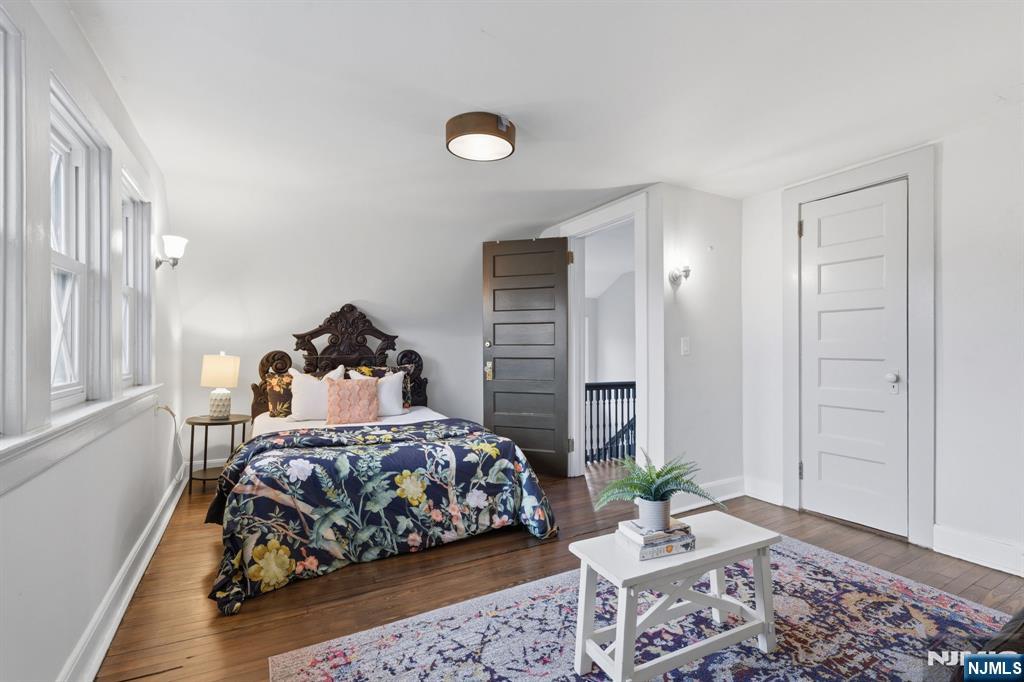 44 Norman Road Montclair, NJ 07043 - Photo 22 of 40 a bedroom with a bed and wooden floor