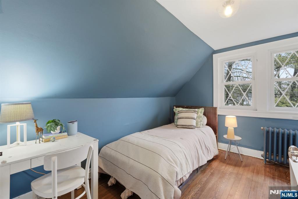 44 Norman Road Montclair, NJ 07043 - Photo 24 of 40 a bedroom with a bed and a table in it