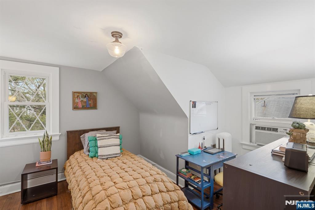 44 Norman Road Montclair, NJ 07043 - Photo 25 of 40 a bedroom with a bed and a table in it