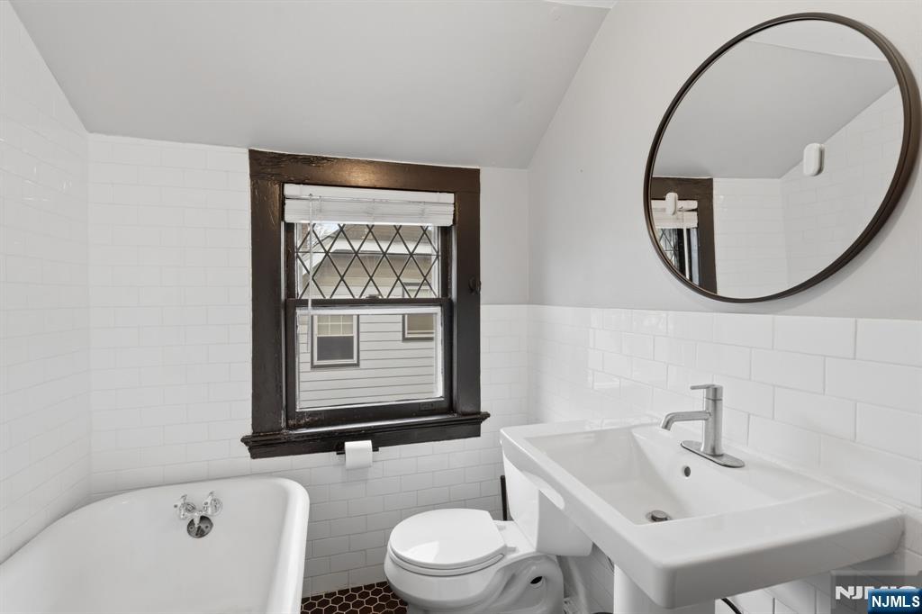 44 Norman Road Montclair, NJ 07043 - Photo 26 of 40 a bathroom with a toilet a sink and a mirror