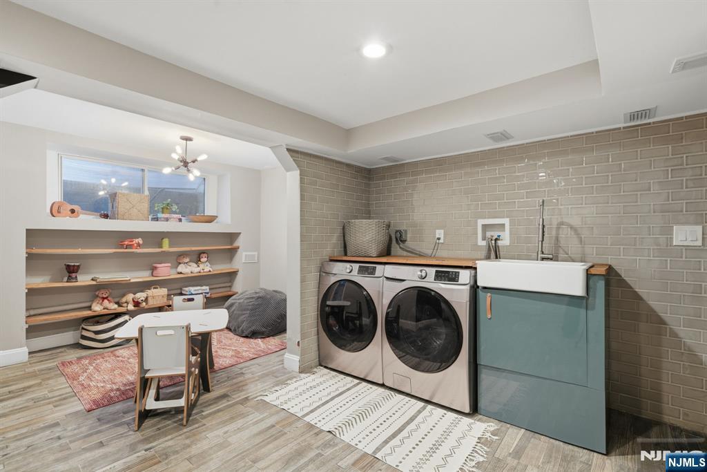 44 Norman Road Montclair, NJ 07043 - Photo 27 of 40 a utility room with sink dryer and washer