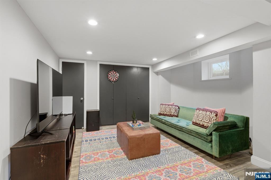 44 Norman Road Montclair, NJ 07043 - Photo 28 of 40 a living room with furniture and a flat screen tv