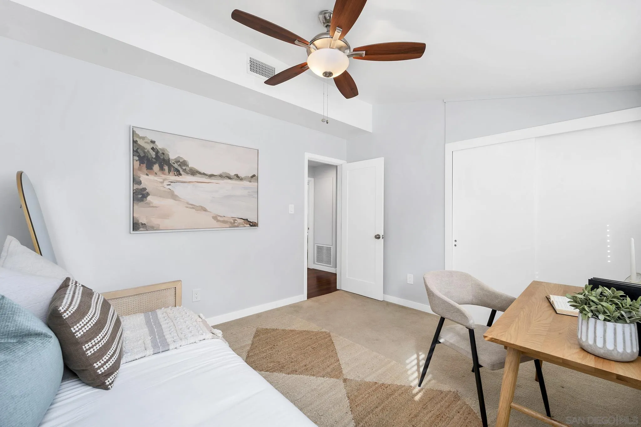 12938 Conley Street Poway, CA 92064 - Photo 17 of 30 a bedroom with a bed and a chandelier