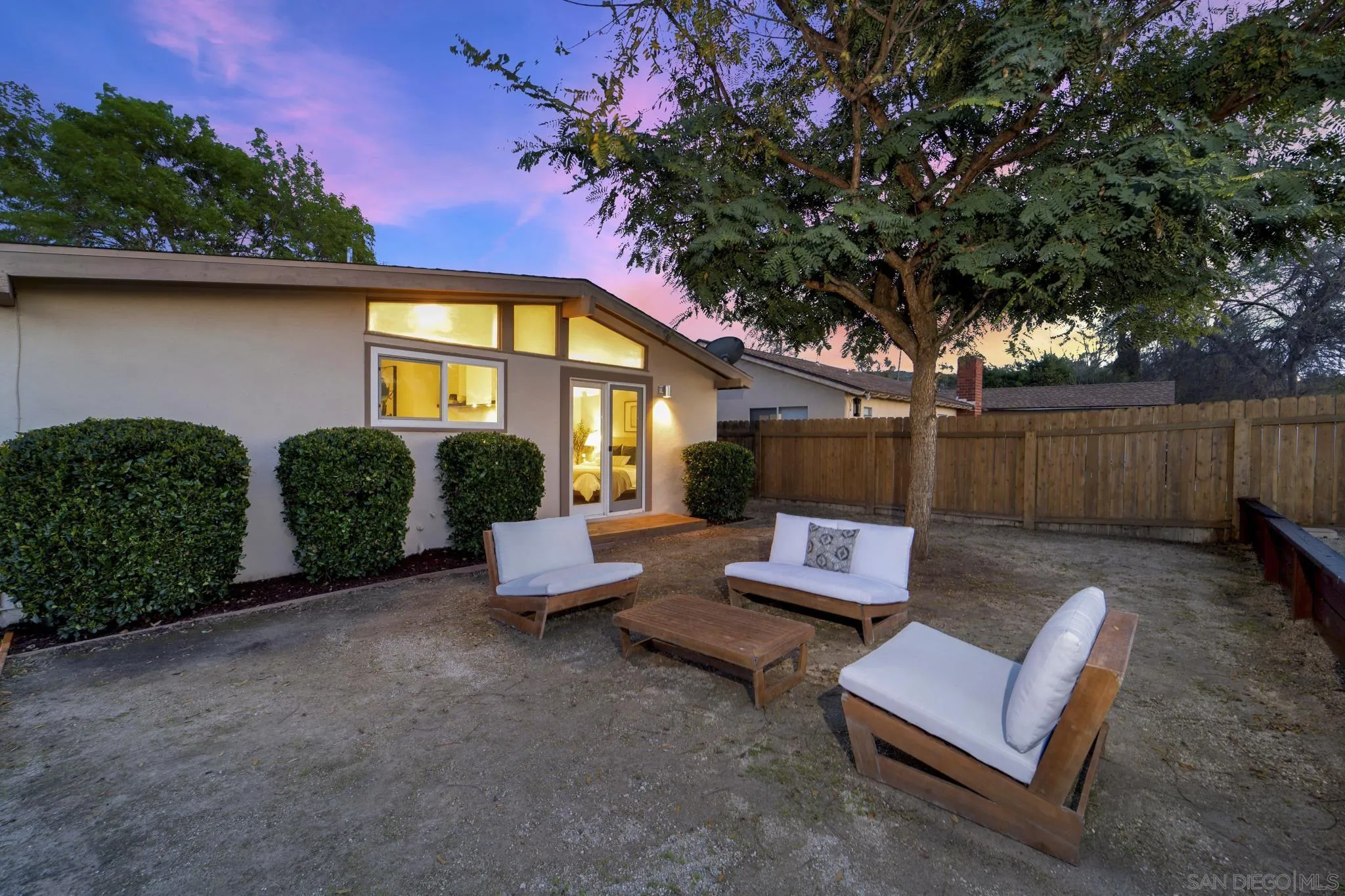 12938 Conley Street Poway, CA 92064 - Photo 25 of 30 a wooden bench sitting in front of a building