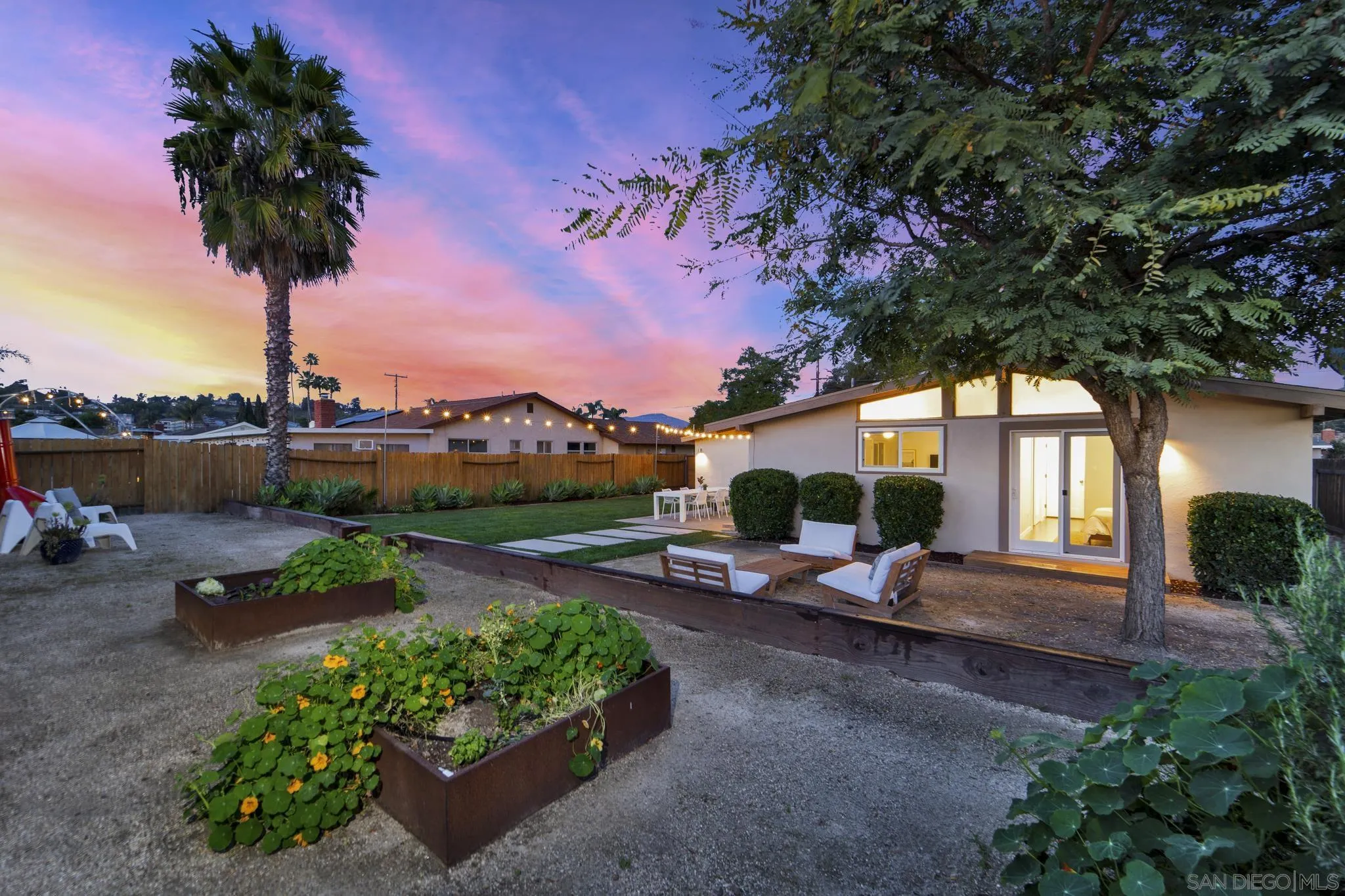 12938 Conley Street Poway, CA 92064 - Photo 26 of 30 a front view of a house with a garden and lake view