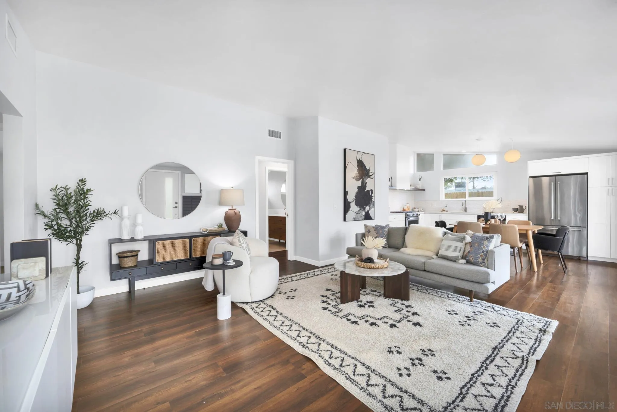 12938 Conley Street Poway, CA 92064 - Photo 4 of 30 a living room with furniture a table and wooden floor