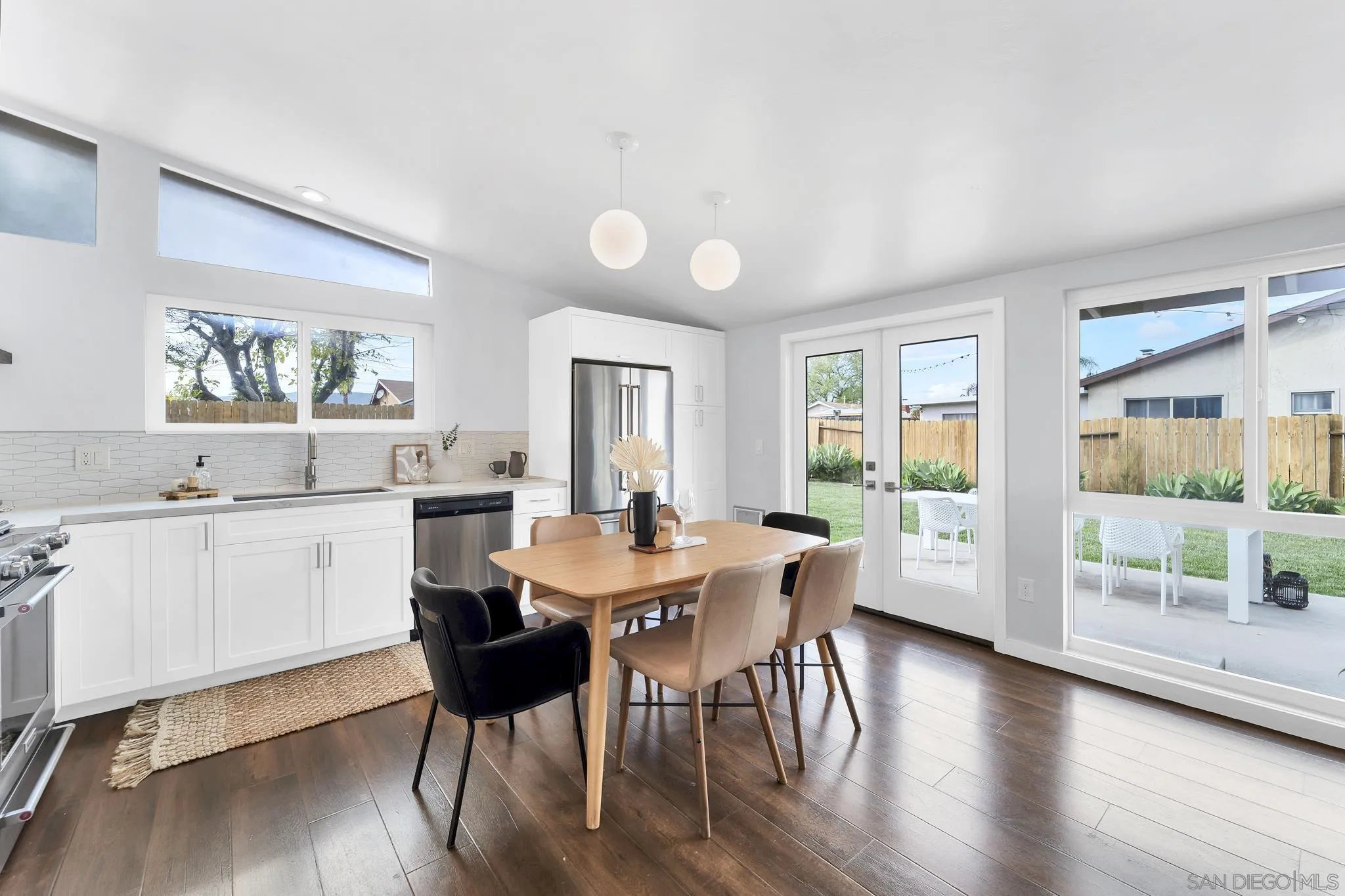 12938 Conley Street Poway, CA 92064 - Photo 7 of 30 a view of a dining room with furniture and wooden floor