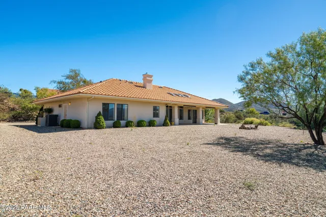 a view of a house with a snow in the yard