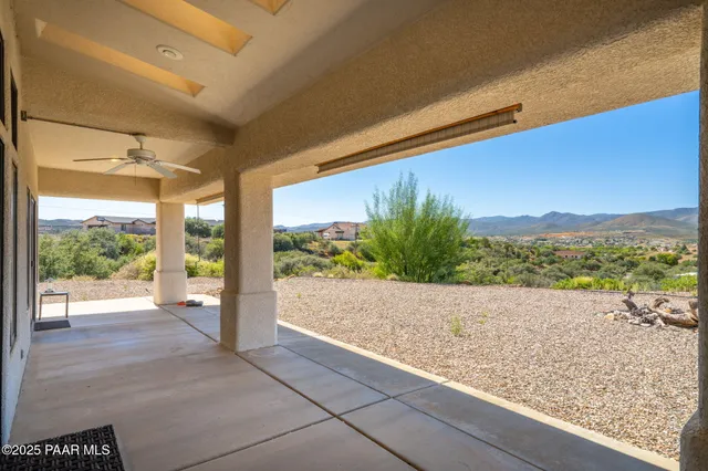 a wooden floor and a building in the background