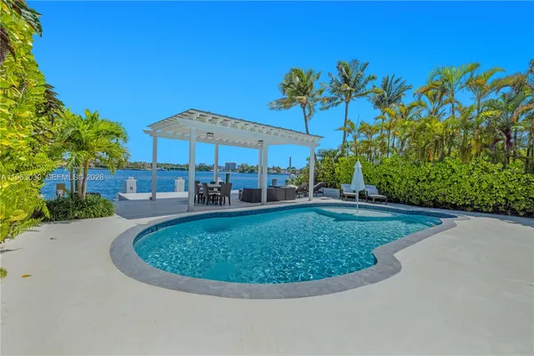 a view of a swimming pool and lounge chair
