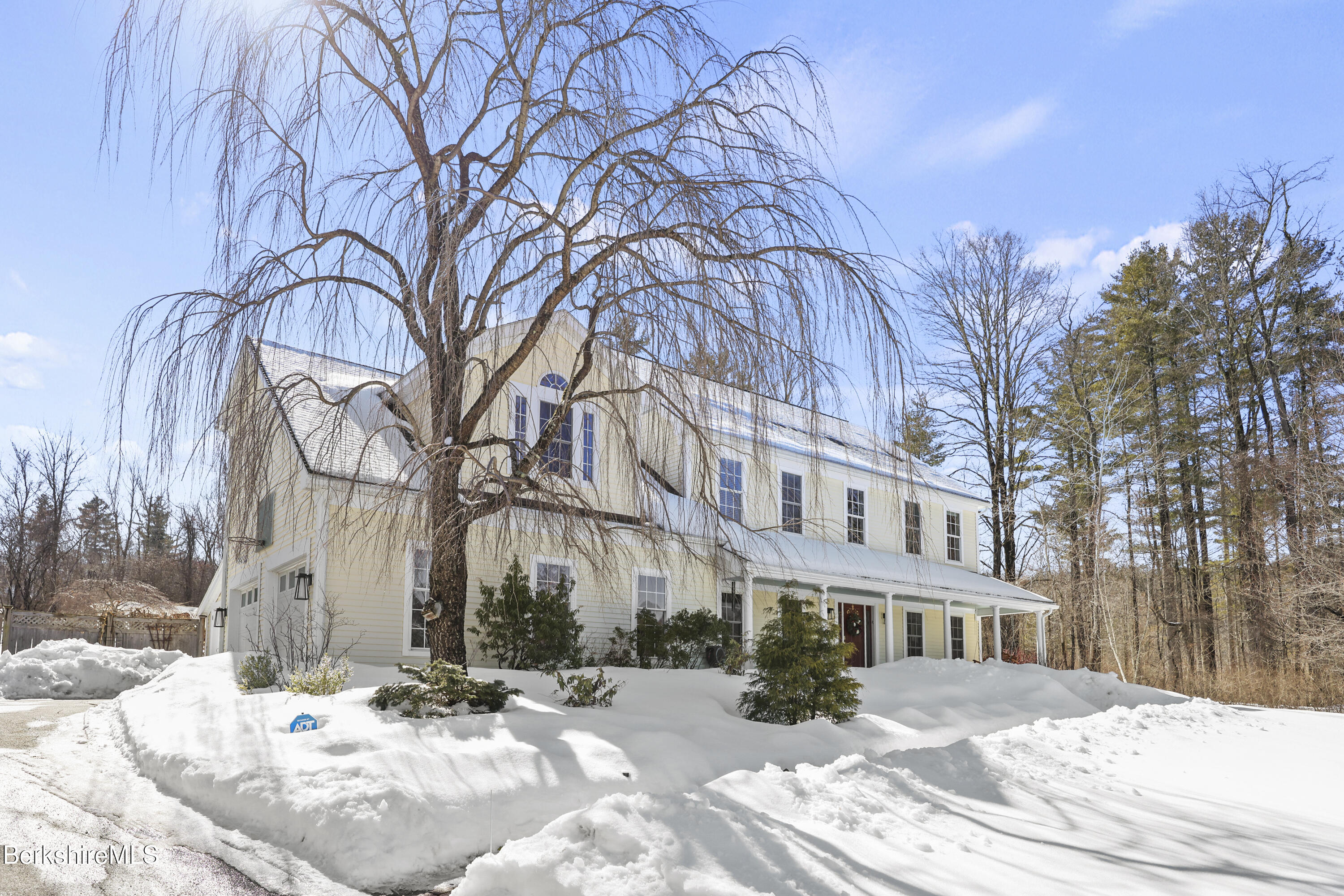 130 East Dugway Road Lenox, MA 01240 - Photo 1 of 89 a view of a building with a snow in the yard