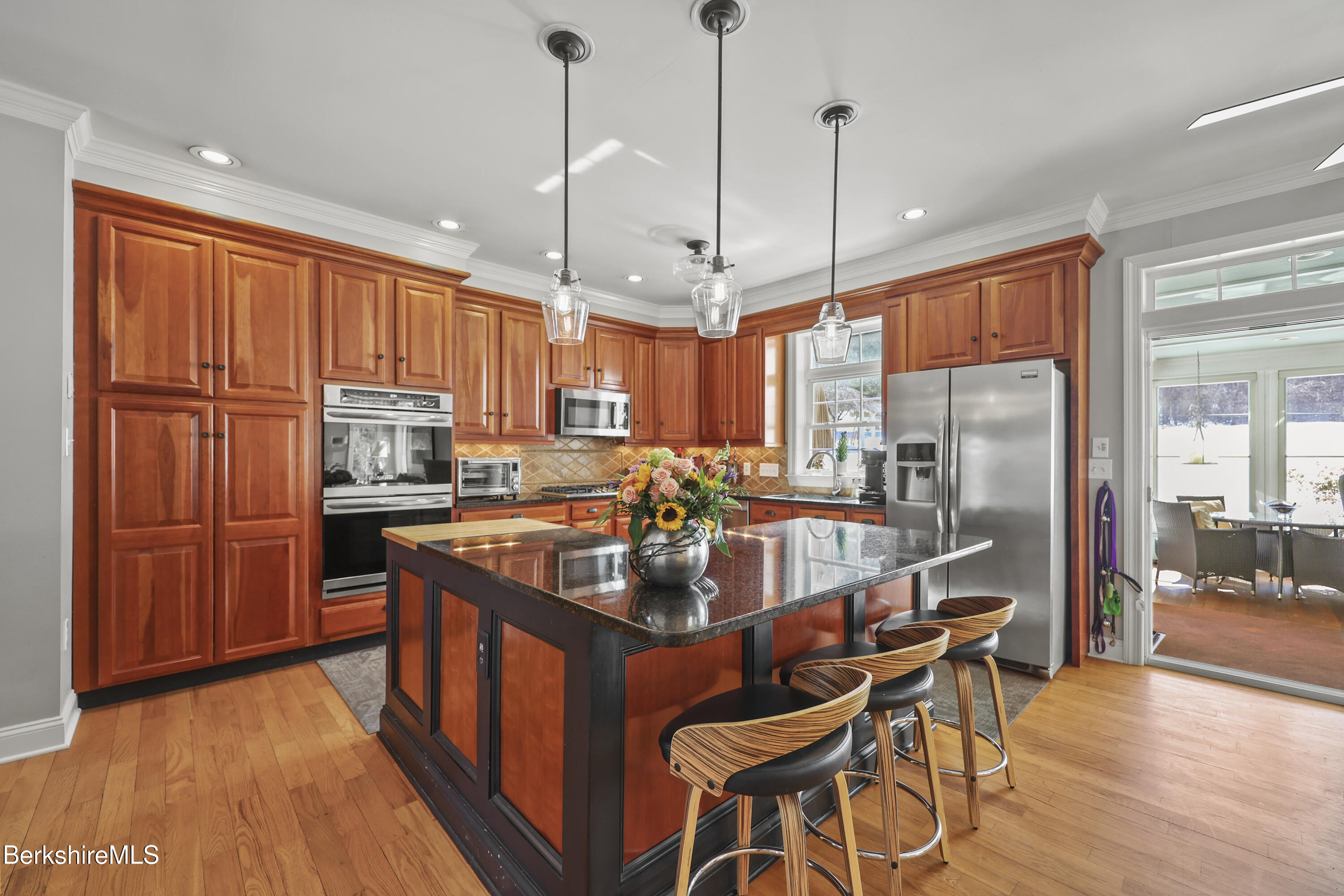 130 East Dugway Road Lenox, MA 01240 - Photo 11 of 89 a kitchen with stainless steel appliances granite countertop a refrigerator a sink dishwasher a stove and a dining table with wooden floor